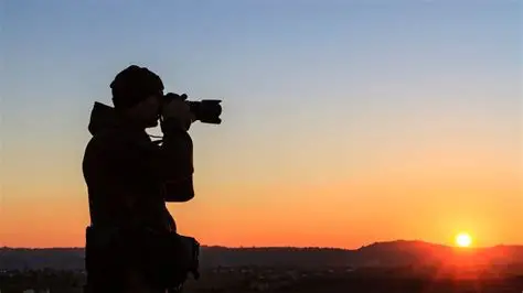 camera man with a sunset